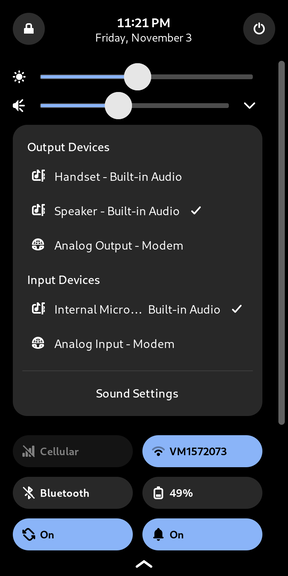
  The same notification drawer, but with the audio panel expanded. It shows both
  input and output devices and allows swapping between them.
